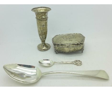 A silver serving spoon, one other silver spoon, a silver trinket box and a silver vase, a/f, (total weight including the weig