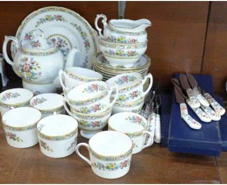 A collection of Coalport Ming Rose tea and coffee wares including pot, also with bone china handled knives, forks, spoons and