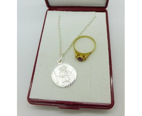 A 14ct gold, ruby and diamond ring and a silver St. Christopher pendant and chain, ring 1.6g, L