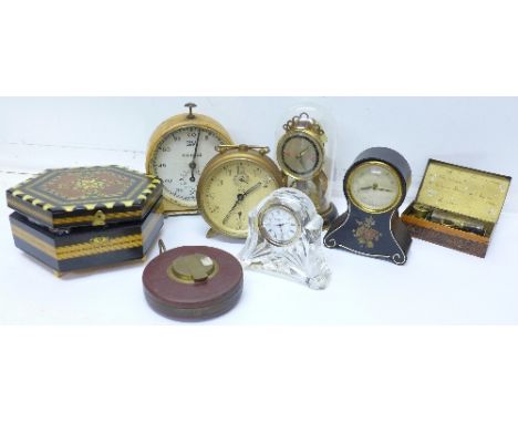 Four clocks, a Smiths darkroom timer, tape measure, music box and a box with wristwatches and badges