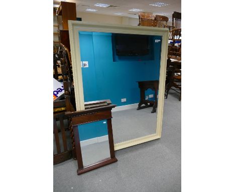 Large over painted bevel edged wall mirror together with similar smaller item (2). 