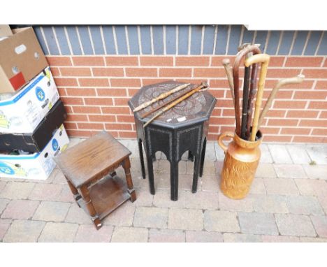 A 20th oak octagonal side table, small occasional table, ceramic jar style umbrella stand with 6 walking sticks, back scratch