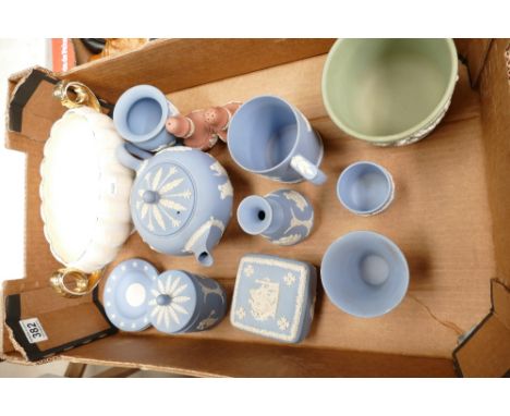 A collection of Wedgwood Jasperware items including teapot, vases, trinket boxes, coral pink condiment set, sage green small 