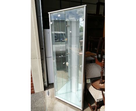 A modern corner unit / display cabinet with mirrored interior and lighting.