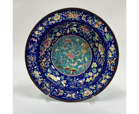 A fine Canton enamel cobalt ground basinChina, Qing Dynasty (1644 - 1912)of circular shape, the centre decorated with flowers