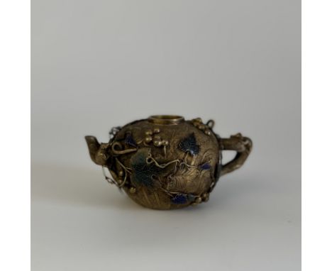 A gilt bronze and champlevé enamel teapotChina, Qing Dynasty (1644 - 1912), Jiaqing (1796 - 1820)Decorated with high relief s