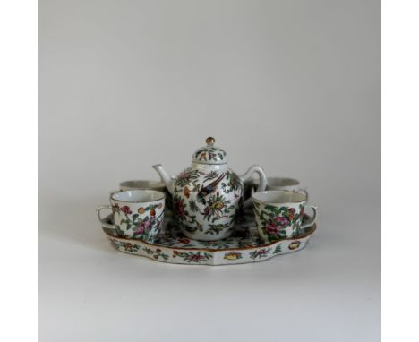 A Canton porcelain tea setChina, Qing Dynasty (1644 - 1912), Guangxu (1875 - 1908)Finely decorated with birds and flowers in 