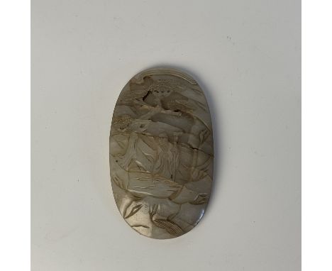 A white jade "ruyi scepter" plaqueChina, Ming Dynasty (1368 - 1644), 17th centuryThis oval jade ruyi plaque finely carved wit
