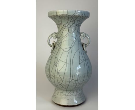 A crackled celadon-glazed porcelain vaseChina, Qing Dynasty (1644 - 1912), Yongzheng (1722 - 1735)Of baluster form with flare