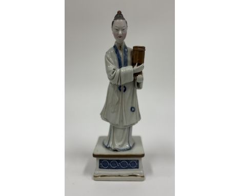 A nodding head court lady porcelain candleholderChina, Qing Dynasty (1644 - 1912), Qianlong (1735 - 1796)The sweetly smiling 