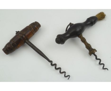 A LATE VICTORIAN CORKSCREW with turned ebonised handle with brush, together with one other corkscrew (2) 