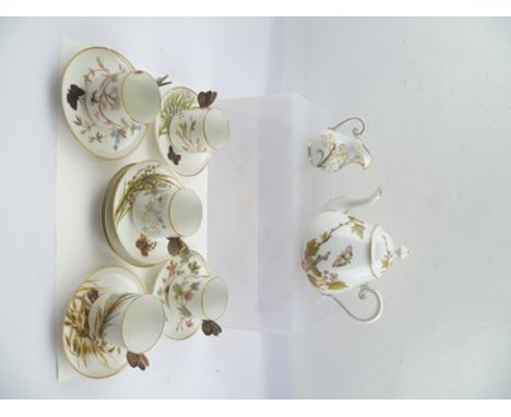 A 20TH CENTURY DRESDEN PORCELAIN PART TEASET comprising; teapot with cover, milk jug, five cups with butterfly handles, seven