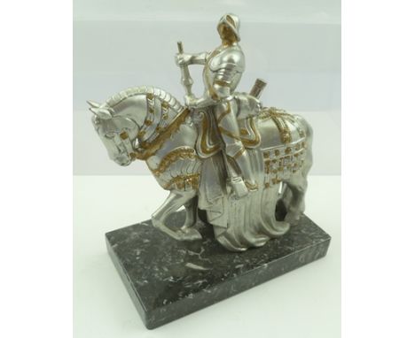 A CAST METAL TABLE LIGHTER IN THE FORM OF A MOUNTED KNIGHT IN ARMOUR, possibly Austrian, raised on a polished marble base, 18
