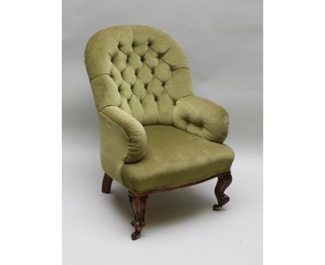 A LATE VICTORIAN BUTTON BACK EASY CHAIR upholstered in pale green fabric, raised on cabriole scroll toe fore supports 