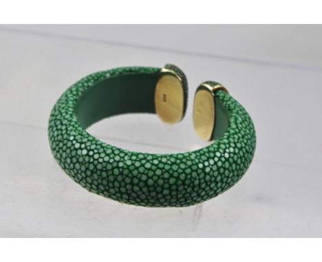 A SHAGREEN SILVER GILT AND STONE SET DESIGNER BANGLE stamped .925 