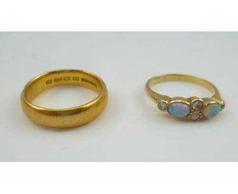 A 22CT GOLD WEDDING BAND, 6g., together with an opal and diamond set lady's RING (mark of band worn, considered to be 18ct) 