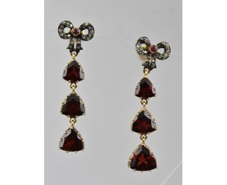 A PAIR OF GARNET SET DROP EARRINGS with diamond bow fittings 