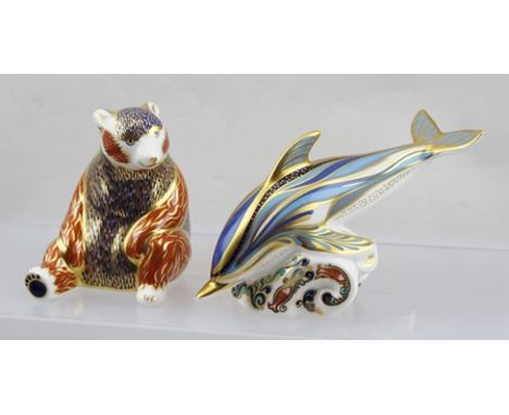 TWO ROYAL CROWN DERBY CERAMIC PAPERWEIGHTS decorated in the gilded Imari palette, a stripe Dolphin and a Honey Bear, both wit