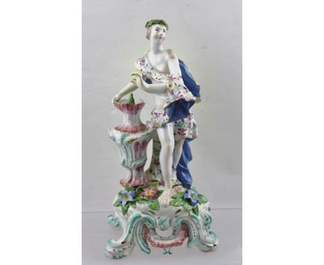 AN 18TH CENTURY BOW PORCELAIN FIGURE "Spring", a classically draped young woman, a wreath upon her head, beside an urn, polyc