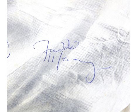 Queen - Radio Ga Ga - A white paper three piece suit signed by all four members of the band, Freddie Mercury, Brian May, John