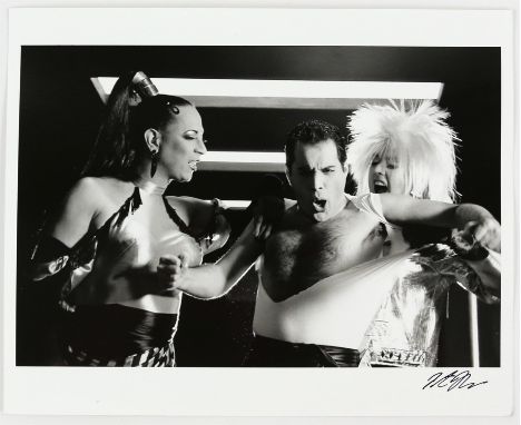 Queen - An original silver gelatin print of Freddie Mercury with Roger Taylor and Peter Straker in drag, on the set of 'The G