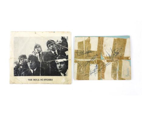 The Rolling Stones - An album page signed by all five members including Mick Jagger, Brian Jones, Keith Richards, Charlie Wat