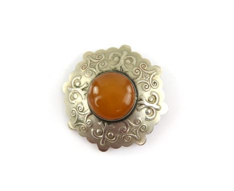 The Lord of the Rings - metal brooch set with amber 'stone' used as set dressing in Gondor, 1 3/4 inches in diameter and a co