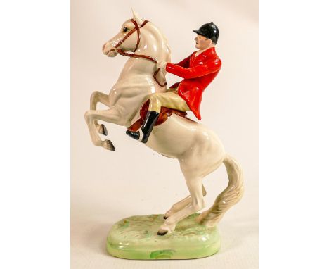 Beswick Huntsman on painted white rearing horse 868. 