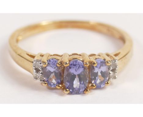 9ct gold Tanzanite &amp; diamond ladies dress ring, size R, weight 2.5g. Fully UK hallmarked and in good condition. 