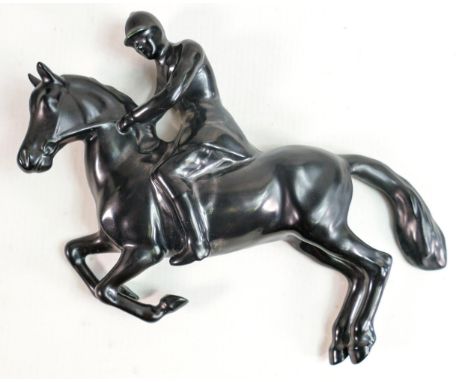 Beswick satin black wall plaque as huntsman on jumping horse 1505. 