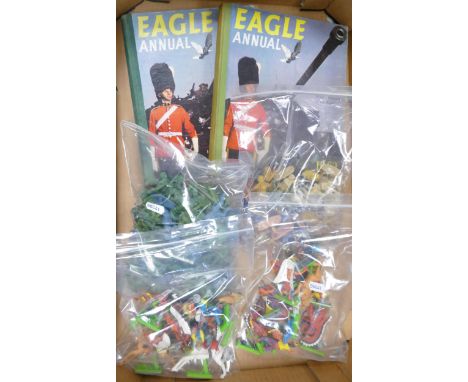 A mixed collection of items to include vintage Britains Ltd toy soldiers &amp; cowboys, later plastic similar items &amp; Eag