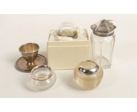 A collection of Silver items including solid serviette ring, small bowl, 96.8g and three silver topped bottles. (5) 