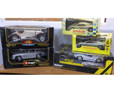 Four die-cast model cars, two Burago and two Maisto, and a Top Gear Lap Timer Sports Car Ford GT40, boxed