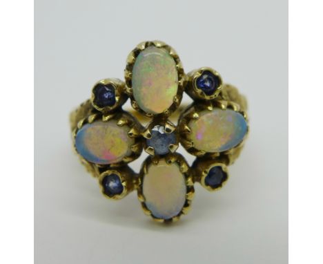 A 9ct gold, opal and sapphire ring, 4.5g, O