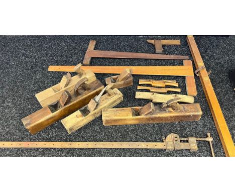 A Collection of vintage joiners tools to include wooden planes, set squares and clamp etc 