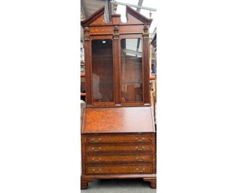 A Grand, Flamed mahogany Maitland- Smith Bureau bookcase/ secretaire. Fitted with brass urn finials, lion head facers and inl