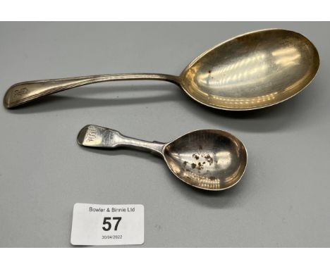 A Georgian silver caddy spoon and a sterling silver serving spoon. 