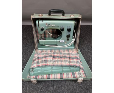 A Vintage Husqvarna Viking [Sweden made] sewing machine with a travel case. 