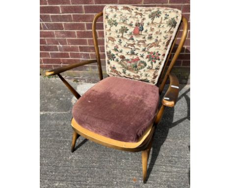 A Vintage ercol spindle back arm chair. [82cm high] 