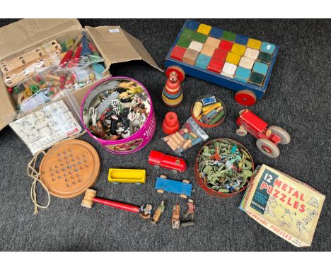 A Collection of vintage wooden and collectable toys to include Metal puzzle game, wooden block set, plastic soldier figures &