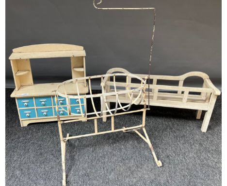 Three vintage childrens role playing toys, Includes haberdashery style cabinet, metal rocking cot and dolls bench. 