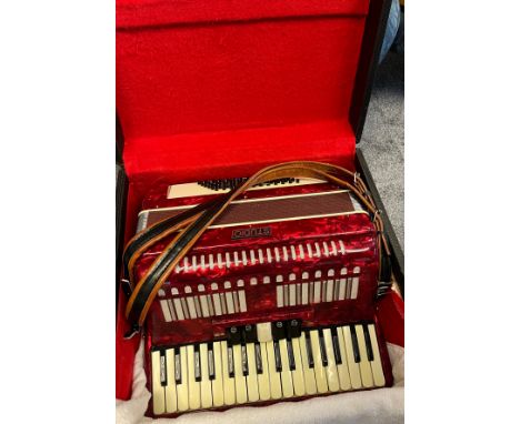 A Studio Accordion with travel case. 