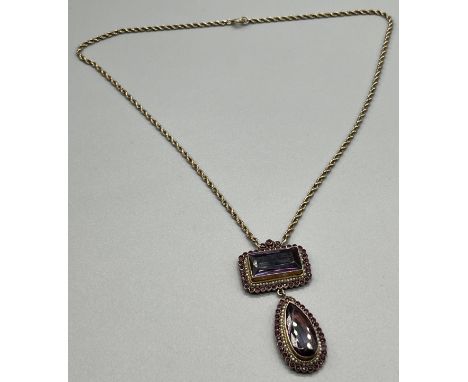 Antique possible gold suffragette style pendant with fitted necklace. Pendant consists of two sections of large amethyst styl
