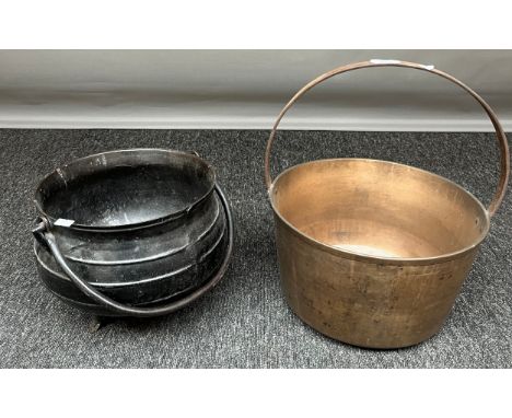 A Vintage brass jelly pan and cast metal cauldron pot with swing handle. 