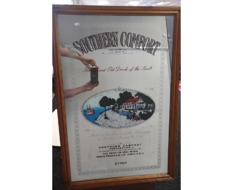 A Vintage Southern Comfort advertising mirror fitted within a pine frame. [93x62cm] 