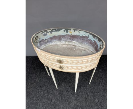A Vintage French metal ornate planter fitted with thin tapered legs and insert tray. [67cm high] 