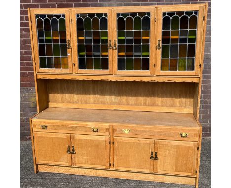 A Vintage light wood Scandinavian dresser, designed with four stainglass and lead doors. [181x178x43cm] 