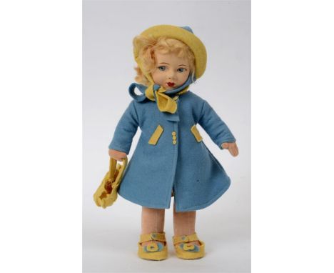 A CHAD VALLEY FELTED CLOTH DOLL with a blonde wig and painted facial features, wearing a pixie patterned dress and matching s