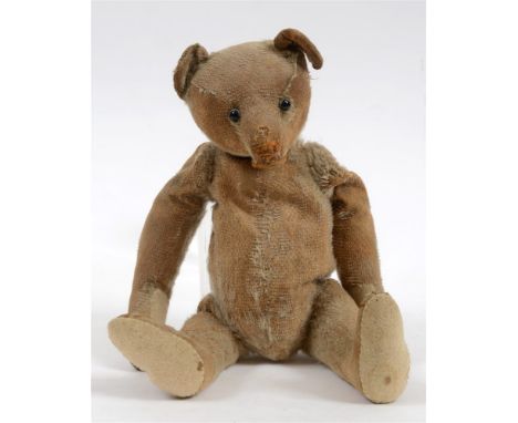 A PALE GOLD MOHAIR TEDDY BEAR probably by Steiff, circa 1910, affectionately known as 'Arthur', with boot button eyes, on a j