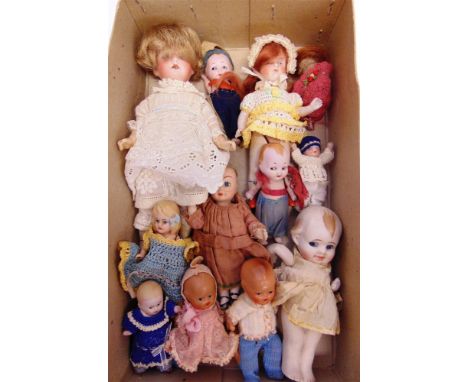 ELEVEN SMALL DOLLS mainly all-bisque or bisque socket head, with two composition, the largest 20cm high and the smallest 6.5c